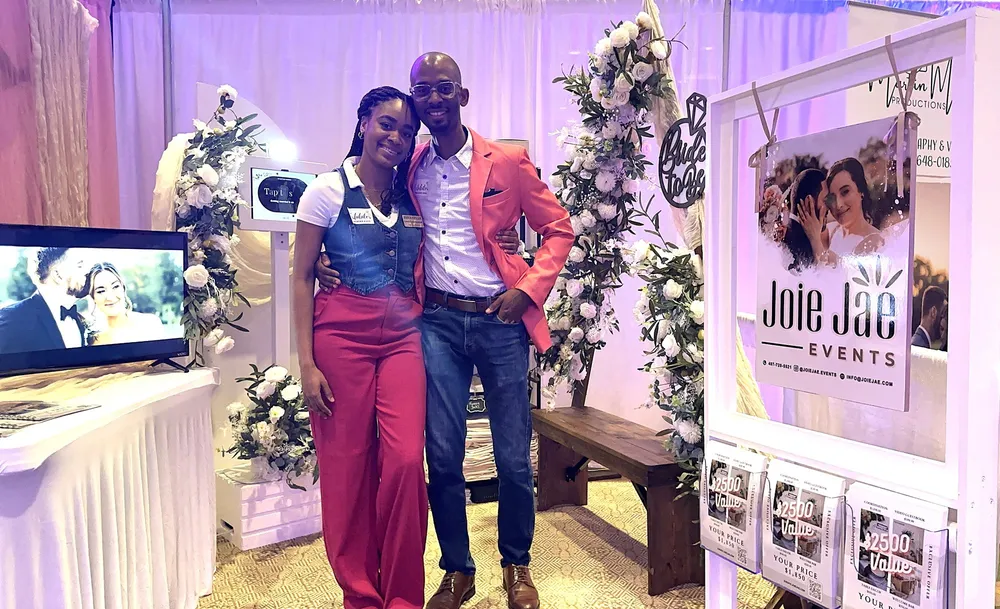 Jheanelle and Raheem at the Joie Jae Events booth at a 2025 wedding show