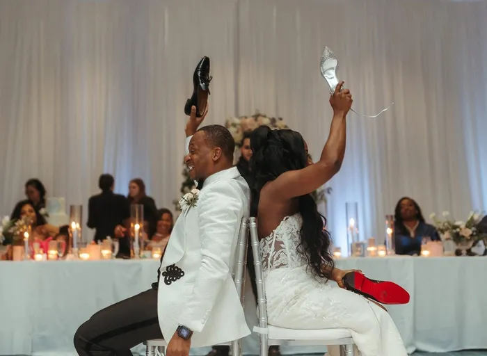 A couple laughing at their reception